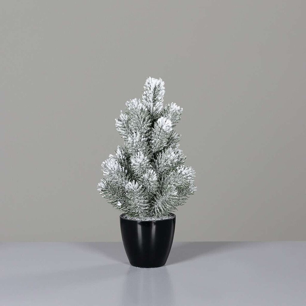 Künstlicher Weihnachtsbaum mit Schnee im Topf